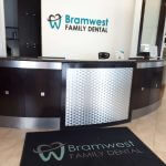 reception area with the bramwest dental logo on the wall